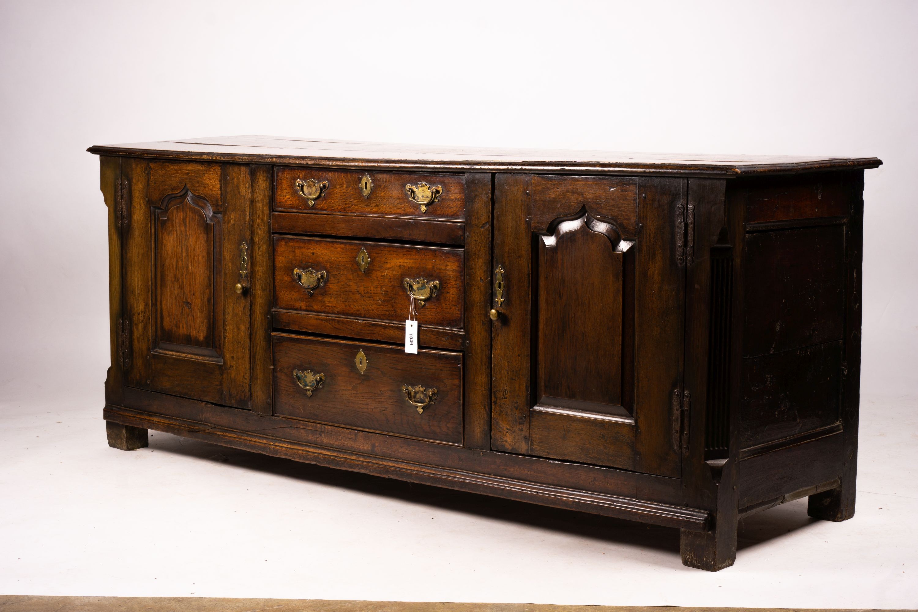 An 18th century oak low dresser base, length 191cm, depth 56cm, height 78cm